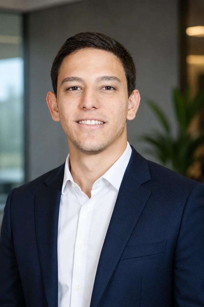 Alessandro Frontaurea, co-founder of The Mochima Studio, in a navy suit and white shirt.